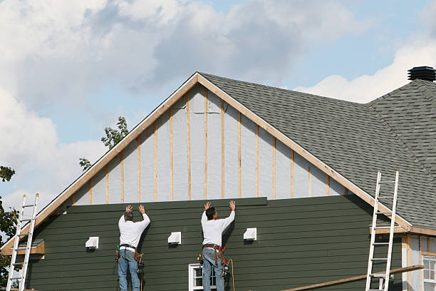 Professional Siding technician working in Queenstown, MD